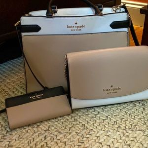 A Kate spade purse, clutch , wallet and keychain.